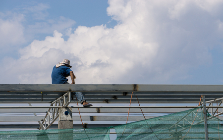 In the construction site, the welding workers at work., worker weld metal in factory and sparks.の写真素材
