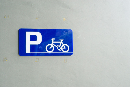 Bicycle Parking Sign on wallの写真素材