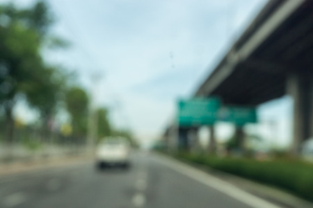 Blurred image traffic on the road from inside car bangkok thailand.,の写真素材