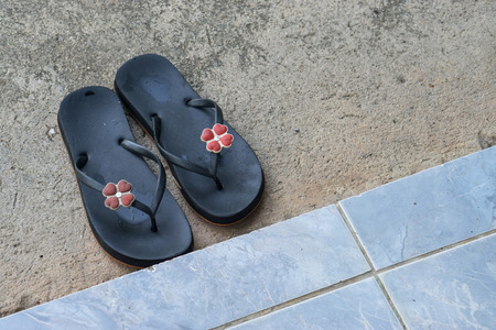 Top view of female sandals on the cement floor., with copy space for text.の写真素材