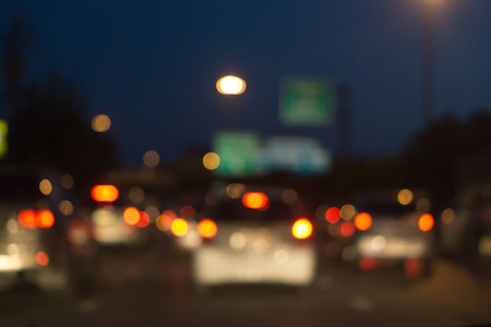 Blurred photo light of traffic car on the city street, abstract blur bokeh backgroundの写真素材