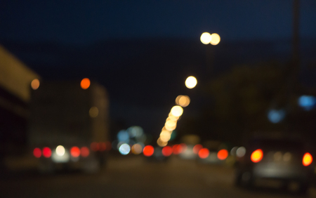 Blurred photo light of traffic car on the city street, abstract blur bokeh backgroundの写真素材