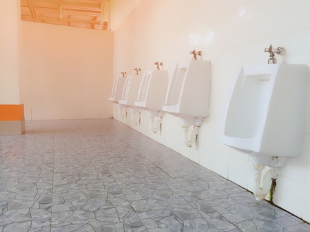 clean urinals men in gas station toiletの写真素材