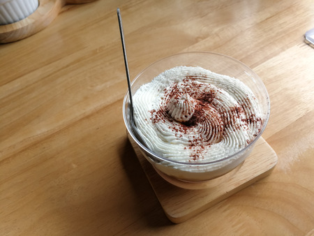 Chocolate mousse cream icing on brown wooden background.の写真素材