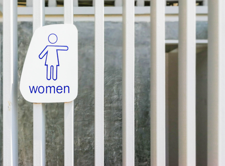 Female toilet sign on wooden wall.の写真素材