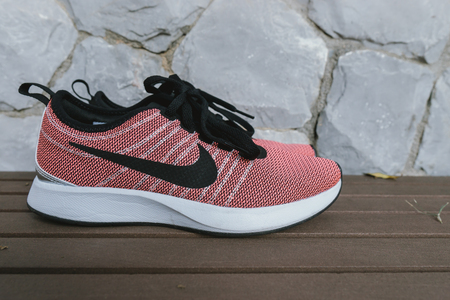 Bangkok, Thailand - May 8, 2018: The NIKE pink shoes with red box of women for exercise at the park., Nike Womens Free Run Flyknit 2 - Fire Pink/Black-Hyper Grape-Racer Pink.のeditorial素材