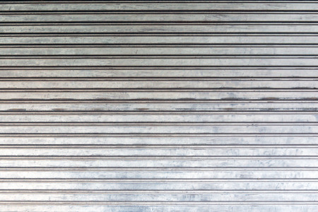 Corrugated metal sheet door., background and texture