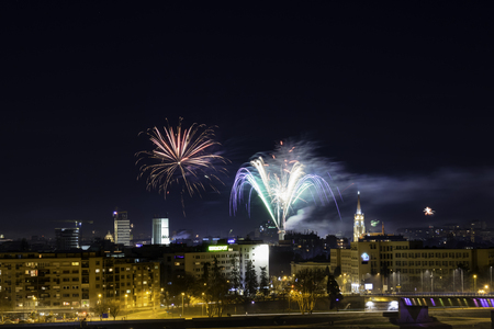 Novi Sad, Serbia-January 1, 2018: Fireworks on New Years Eve in city center, view from Petrovaradin fortress on a city skylineのeditorial素材