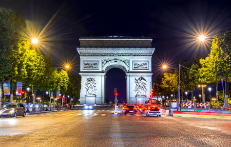 Triumphal arch (Arc de Triomphe) at night, Paris, Franceのeditorial素材