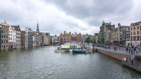 Buildings on Damrak canal, Amsterdam architecture, Netherlandsの写真素材