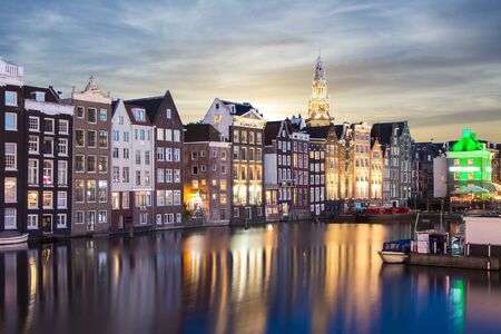 Amsterdam architecture at Damrak canal at night, Netherlandsの写真素材