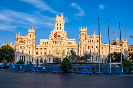 Cybele palace and fountain on Cibeles square at sunset, Madrid, Spainのeditorial素材