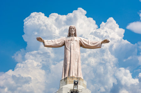 Statue of Jesus Christ above Tibidabo Cathedral in Barcelona, Spainのeditorial素材