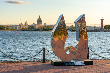 Monument to russian letter Y on Hare island with Saint Petersburg cityscape at background, Russia
