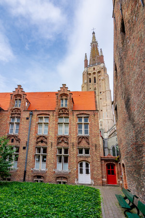 Old Bruges architecture and Church of Our Lady, Belgiumのeditorial素材