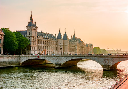 Conciergerie palace at sunset over Seine river, Paris, Franceのeditorial素材