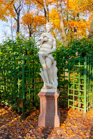 Sculpture of Summer garden in autumn foliage, Saint Petersburg, Russia (inscription "Salacity")のeditorial素材
