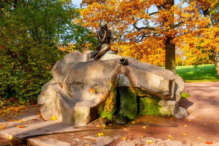 Statue of girl with broken jar in autumn Catherine park, Pushkin (Tsarskoe Selo), Saint Petersburg, Russiaのeditorial素材