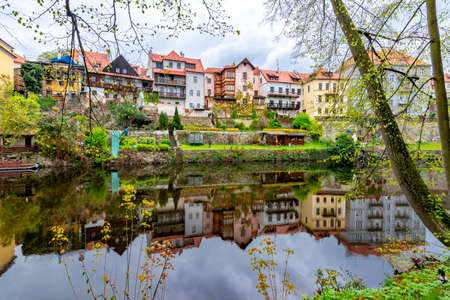 Architecture of Cesky Krumlov reflected in Vltava river, Czech Republicの写真素材
