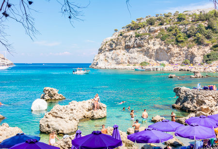 Rhodes, Greece - September 2018: Tourists on beach of Anthony Quinn Bayのeditorial素材