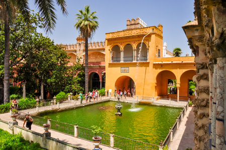 Pond with fountan in Seville Alcazar gardens, Andalusia, Spainのeditorial素材