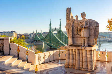 Monument to Saint Istvan on Gellert mountain with Elisabeth (Erzsebet) bridge over Danube river in Budapest, Hungary (translation "King Saint Stephen")のeditorial素材