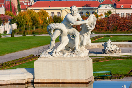 Statue in Belvedere gardens in autumn, Vienna, Austriaのeditorial素材
