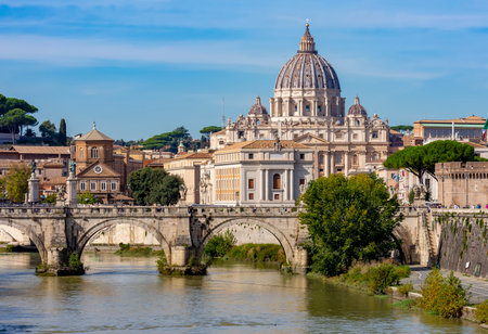 St. Peter's basilica in Vatican and Victor Emmanuel II bridge over Tiber river in Rome, Italyの写真素材