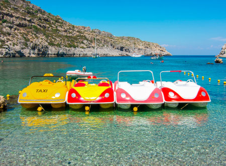 Small catamarans in Anthony Quinn bay on Rhodes island, Greeceの写真素材