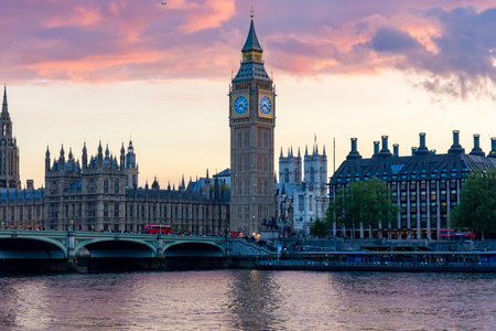 Houses of Parliament with Big Ben tower and Westminster bridge at sunset, London, UKの写真素材