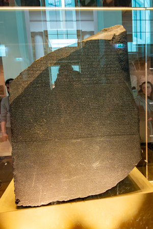 London, UK - 27 April 2024: Famous Rosetta stone from Egypt in British museumの写真素材