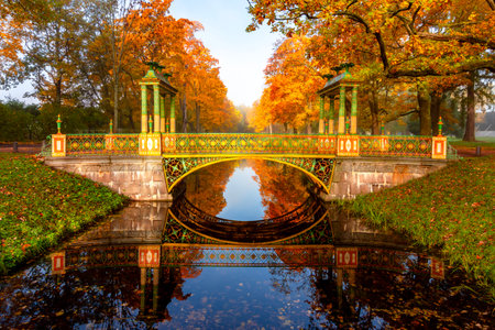 Bridge and autumn foliage in Alexander park, Pushkin (Tsarskoe Selo), St. Petersburg, Russiaの写真素材
