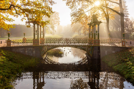 Bridge on misty autumn morning in Alexander park, Pushkin (Tsarskoe Selo), Saint Petersburg, Russiaの写真素材