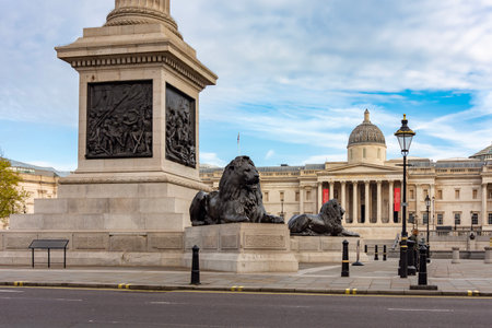 Trafalgar square with Nelson monument lions and National Gallery, London, UKの写真素材
