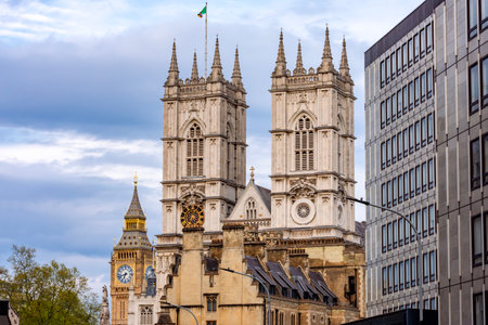 Towers of Westminster Abbey with Big Ben at background, London, UKの写真素材