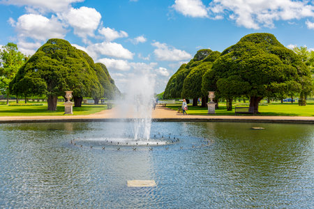 Pond with fountain in Hampton Court gardens, London, UKの写真素材