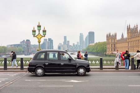 London, UK - 02 May 2024: Black cab on Westminster bridgeの写真素材