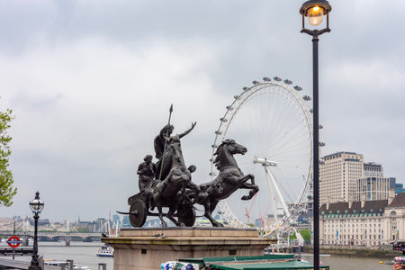 London, UK - 02 May 2024: Boadicea (Victory) monument on Westminster bridge and Millennium Wheelの写真素材