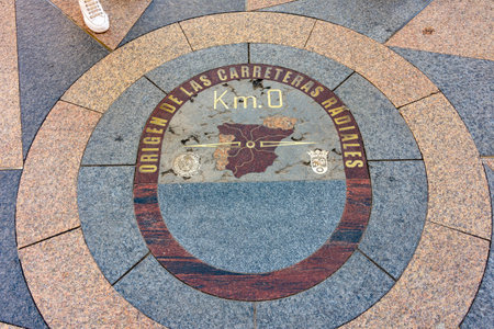 Zero kilometer on Puerta del Sol square in center of Madrid, Spain (inscription Origin of radial...