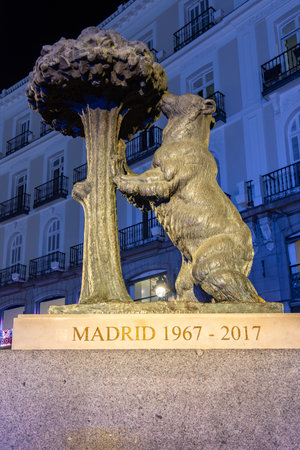 Madrid, Spain - 26 March 2025: Statue of Bear and Strawberry tree on Puerta del Sol square at nightの写真素材