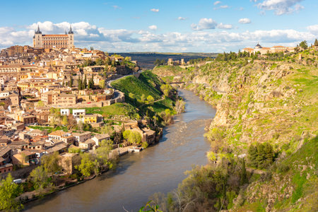 Toledo cityscape with alcazar over old town and Tajo river, Spainの写真素材