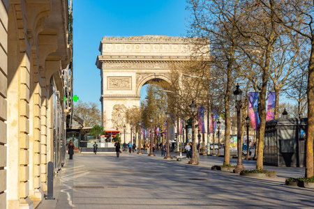 Paris, France - 01 April 2025: Triumphal arch (Arc de Triomphe) and Champs Elysees avenue in Parisの写真素材