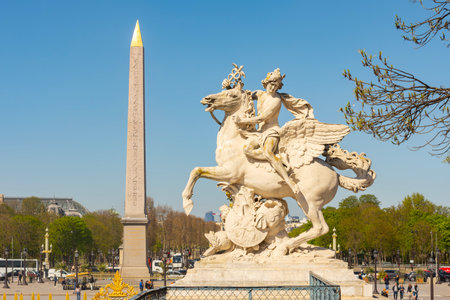 Paris, France - 01 April 2025: Equestrian sculpture and Obelisk of Luxor on place de la Concorde squareの写真素材