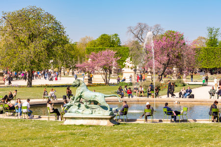 Paris, France - 06 April 2025: People relaxing in Tuileries gardens in springの写真素材