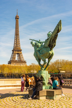 Paris - 03 April 2025: France Reborn statue on Bir-Hakeim bridge and Eiffel towerの写真素材
