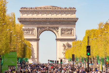 Paris, France - 06 April 2025: Triumphal arch (Arc de Triomphe) and Champs Elysees avenue in Paris