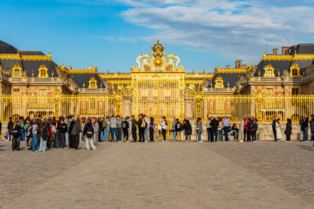 Paris, France - 04 April 2025: Tourists at Golden gate of Versailles palaceの写真素材