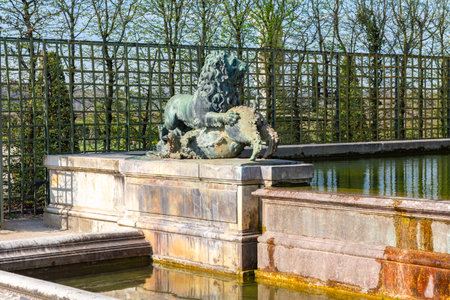 Lion fountain in Versailles gardens outside Paris, Franceの写真素材