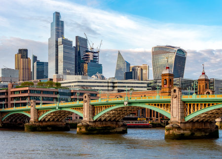 Southwark bridge over Thames river and City of London, UKの写真素材