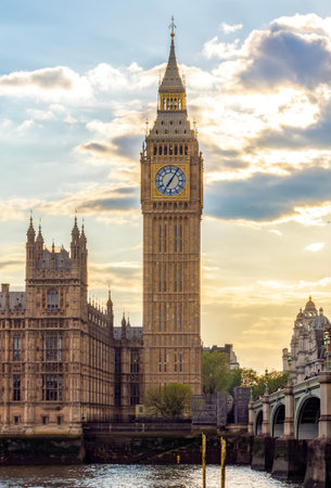 Houses of Parliament with Big Ben tower and Westminster bridge at sunset, London, UK